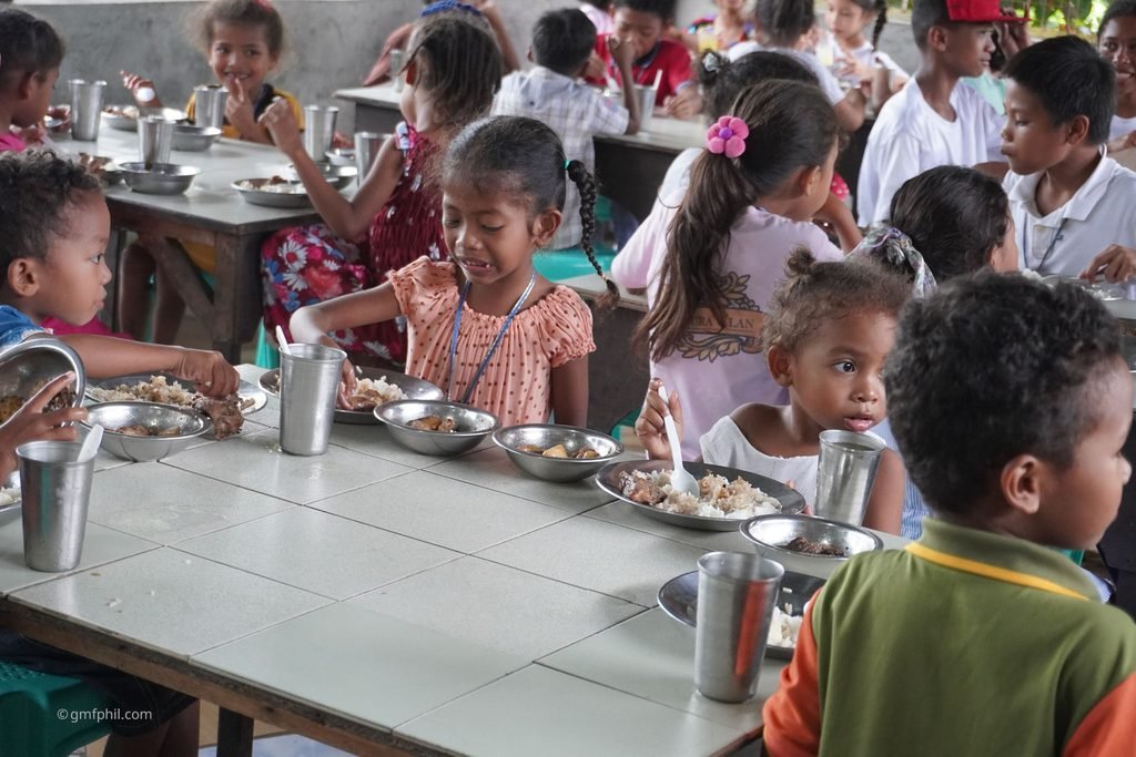 Many Aeta children enjoying their special meal.